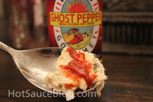 Dave's Gourmet Ghost pepper naga Jolokia Hot sauce On food